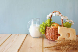 dairy products and fruits on wooden table