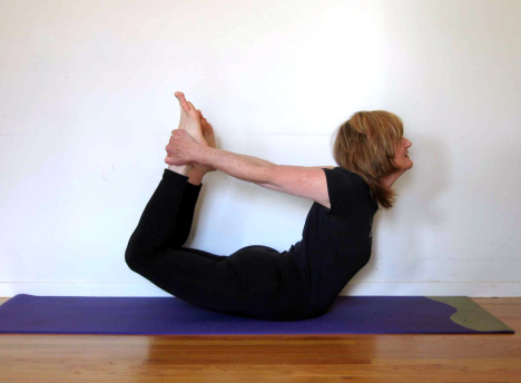 Yoga Instructor, Sara Frazier in a Bow Pose.